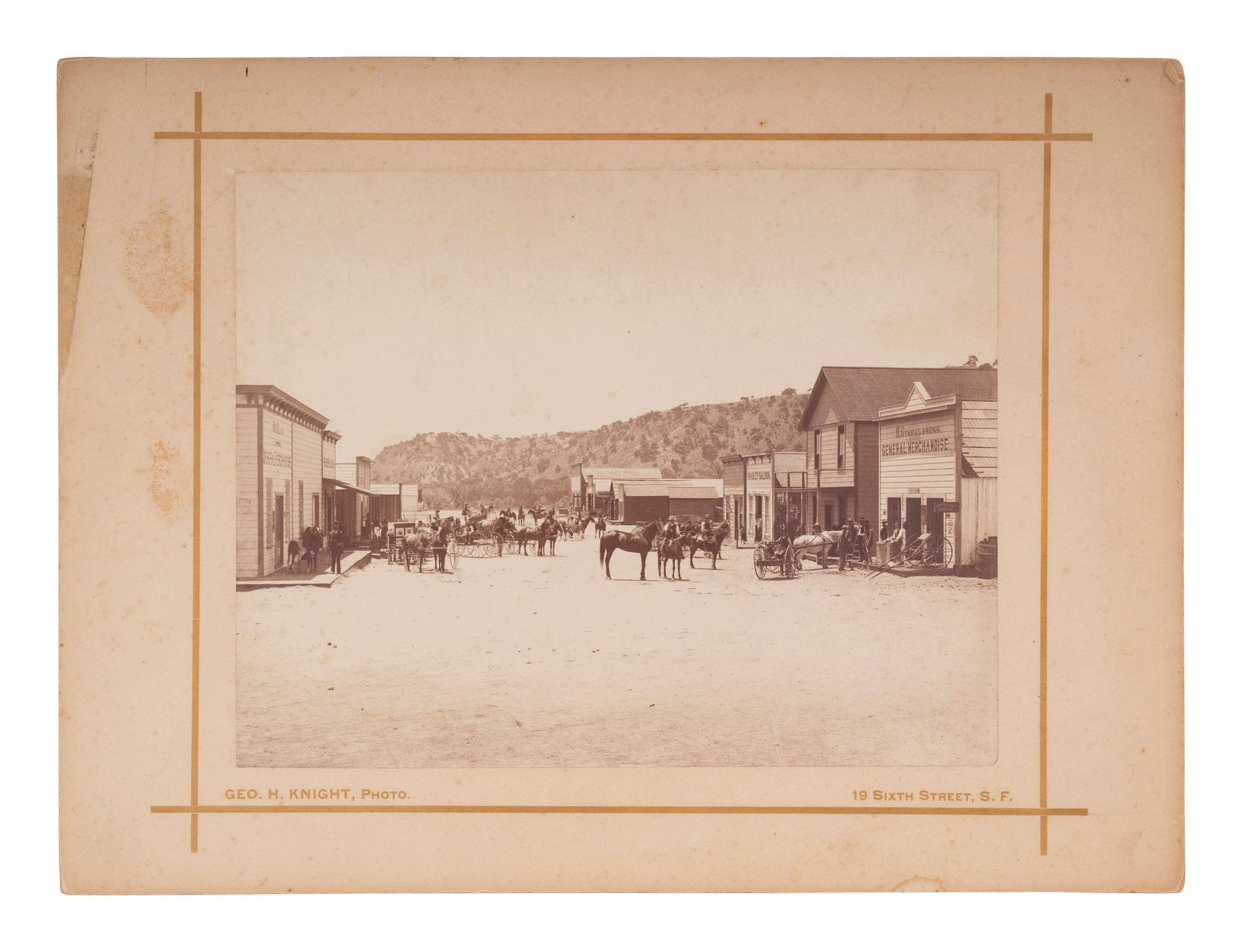 KNIGHT, George H., photographer. Street scene in Bradley, California, including photographer’s wagon. San Francisco, CA: 1886.