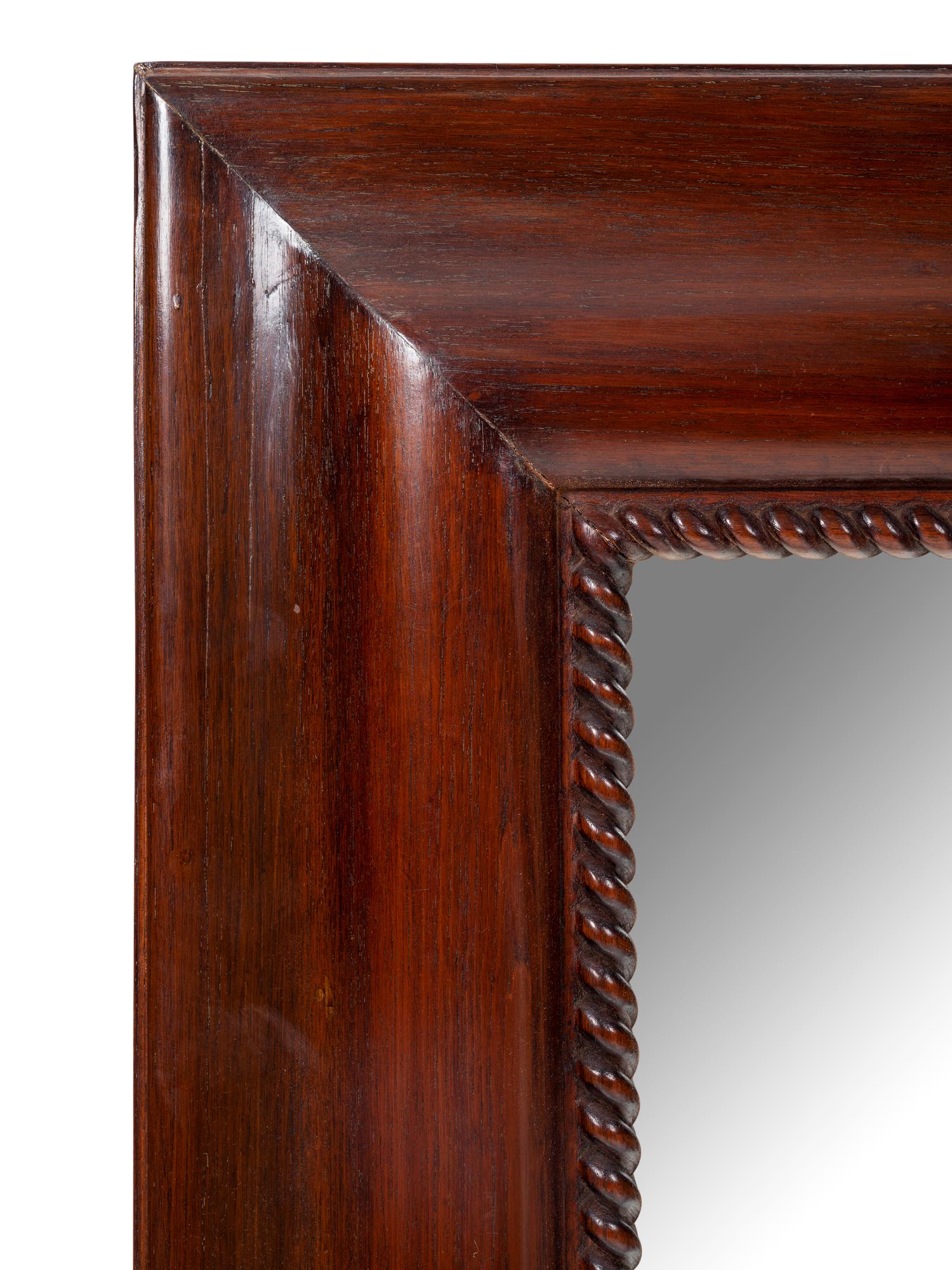 A Contemporary Carved Mahogany Mirror