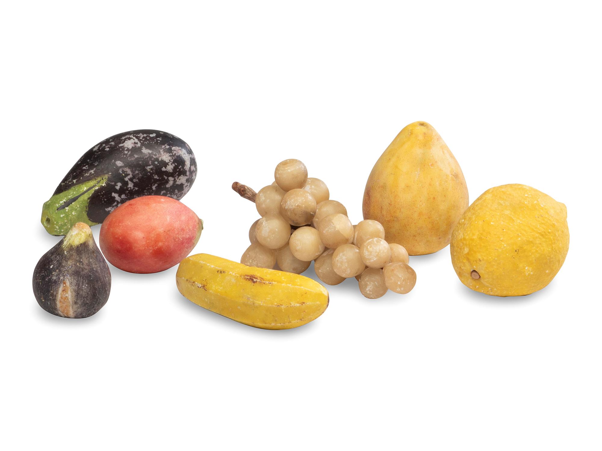 A Group of Carved and Painted Stone Fruit