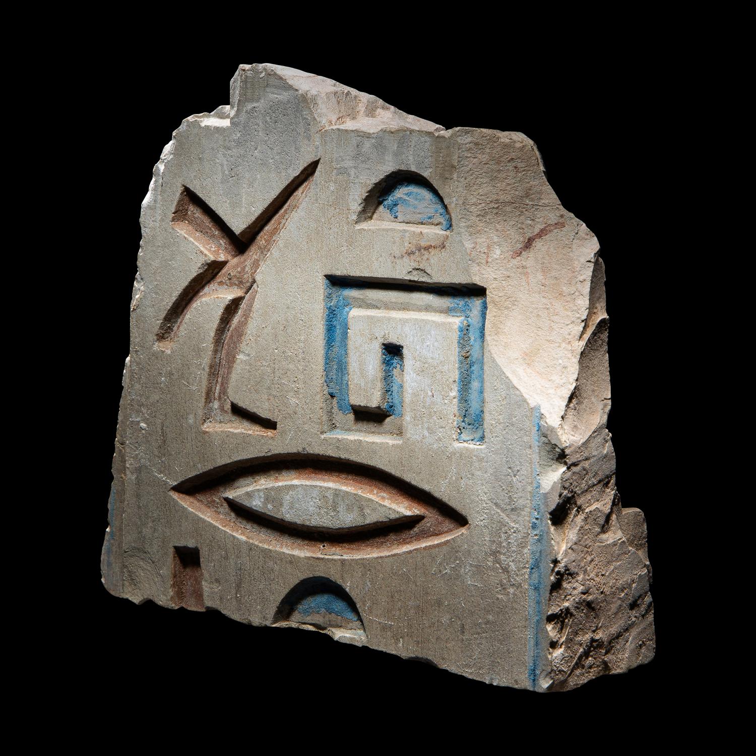 An Egyptian Painted Limestone Relief Fragment