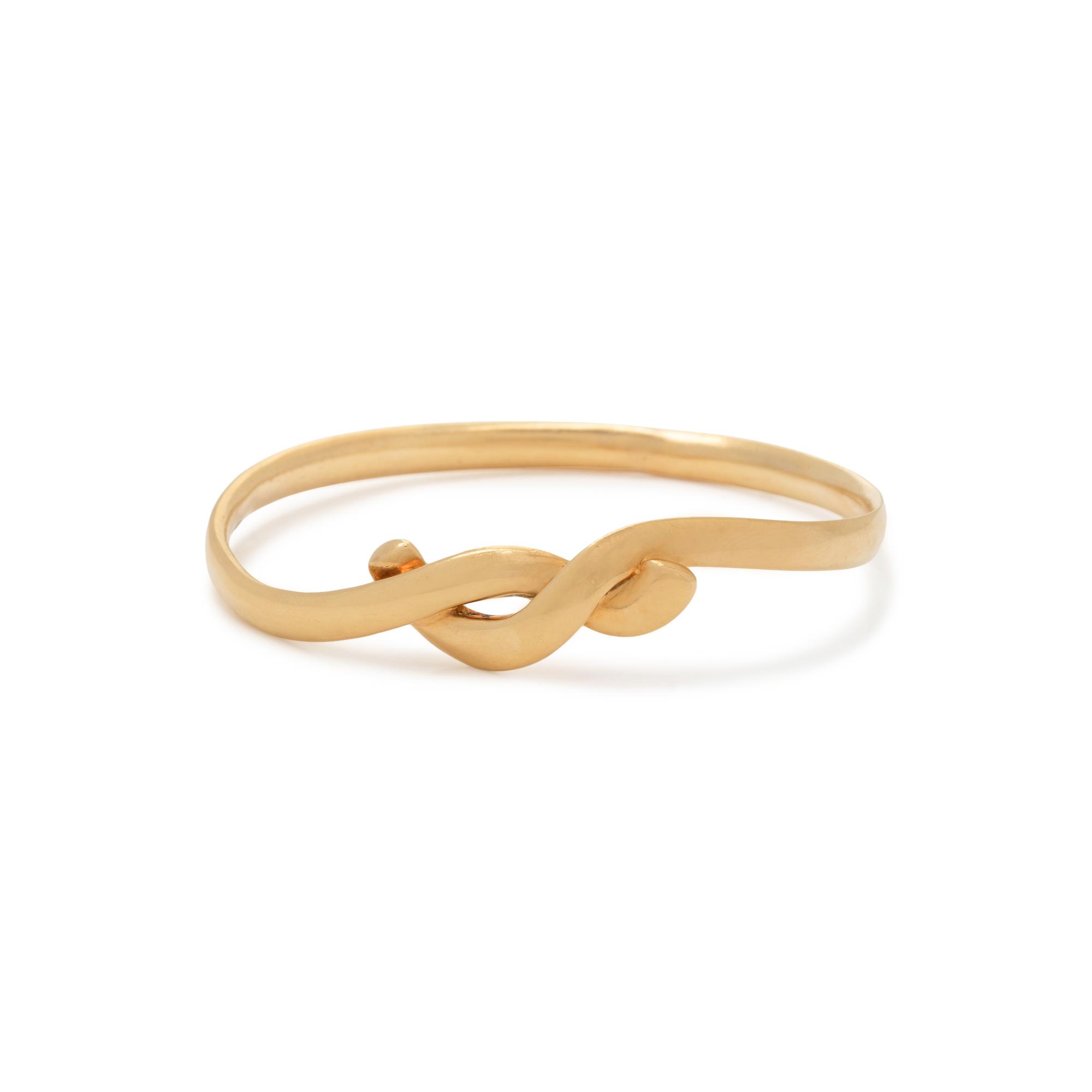 TIFFANY & CO., ANGELA CUMMINGS, YELLOW GOLD BANGLE BRACELET