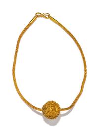 An Islamic Gold Bead — with a gold chain