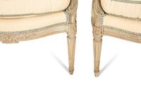 A Set of Four Louis XVI Grey-Painted and Parcel Gilt Fauteuils