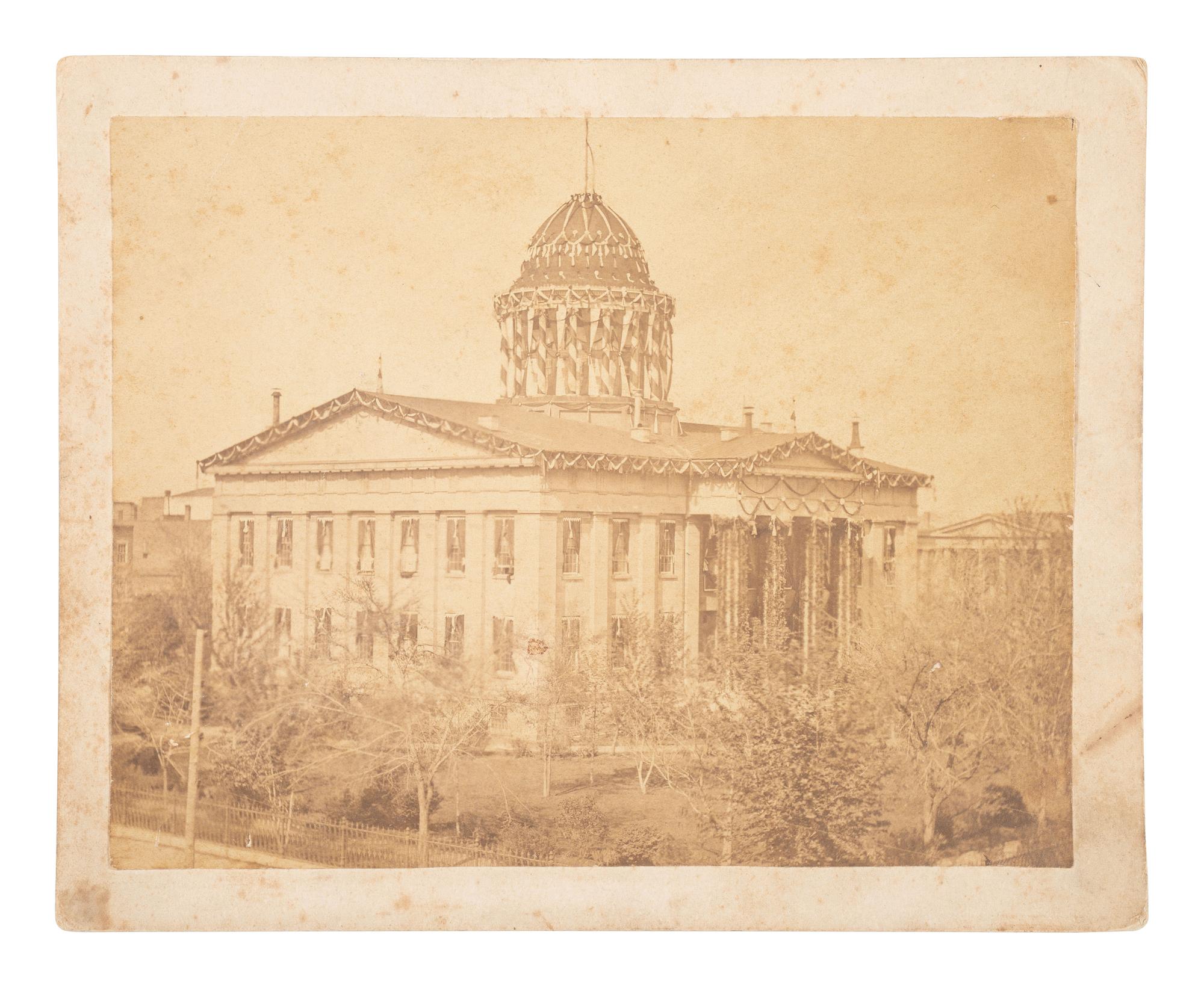 [LINCOLN, Abraham (1809-1865)]. Large format albumen photograph of the Old Capitol in Springfield draped in mourning.