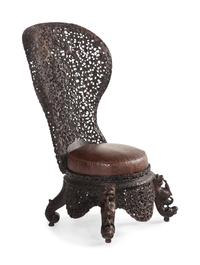 An Anglo-Indian Carved Hardwood Slipper Chair