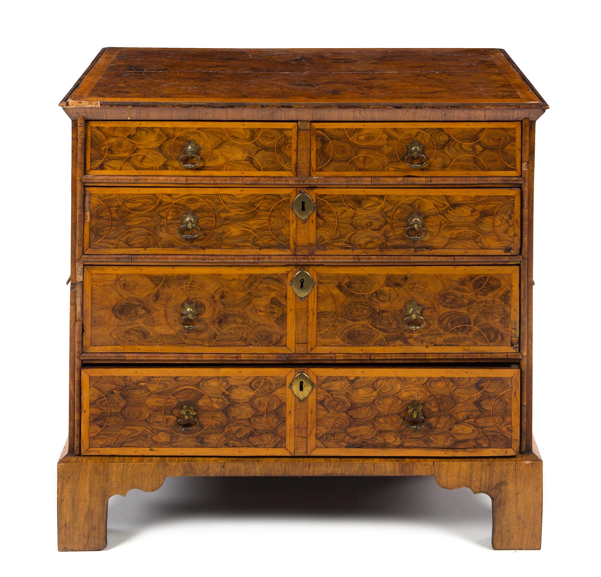 A George II Style Oysterwood Veneered Chest of Drawers Height 34 1/2 x width 38 1/2 x depth 23 inches. — 19TH CENTURY