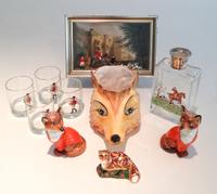 Nine Articles Associated with Foxes Height of vase 10 inches.