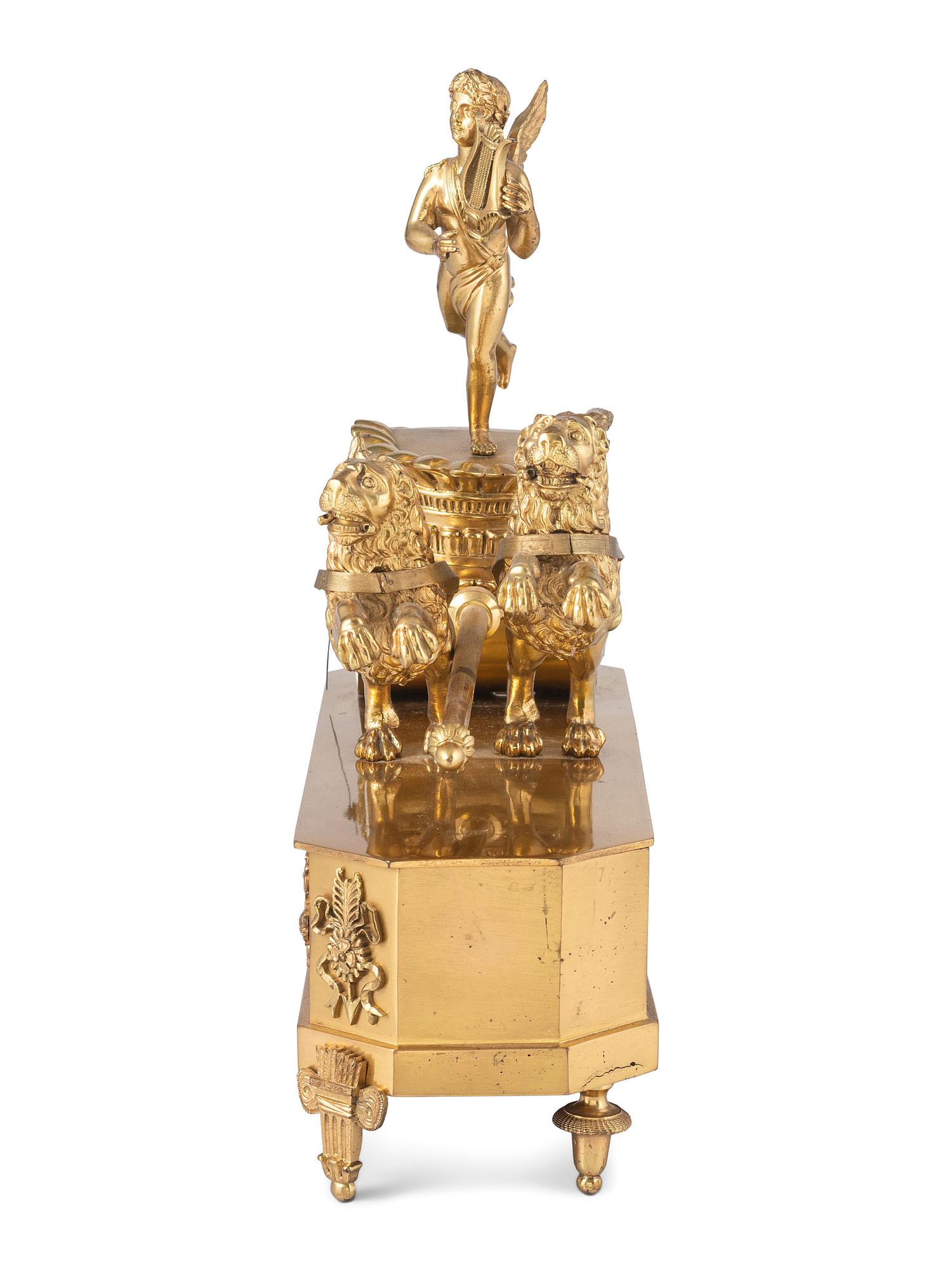 A French Ormolu Mantle Clock in the Form of a Chariot with Apollo and Lions