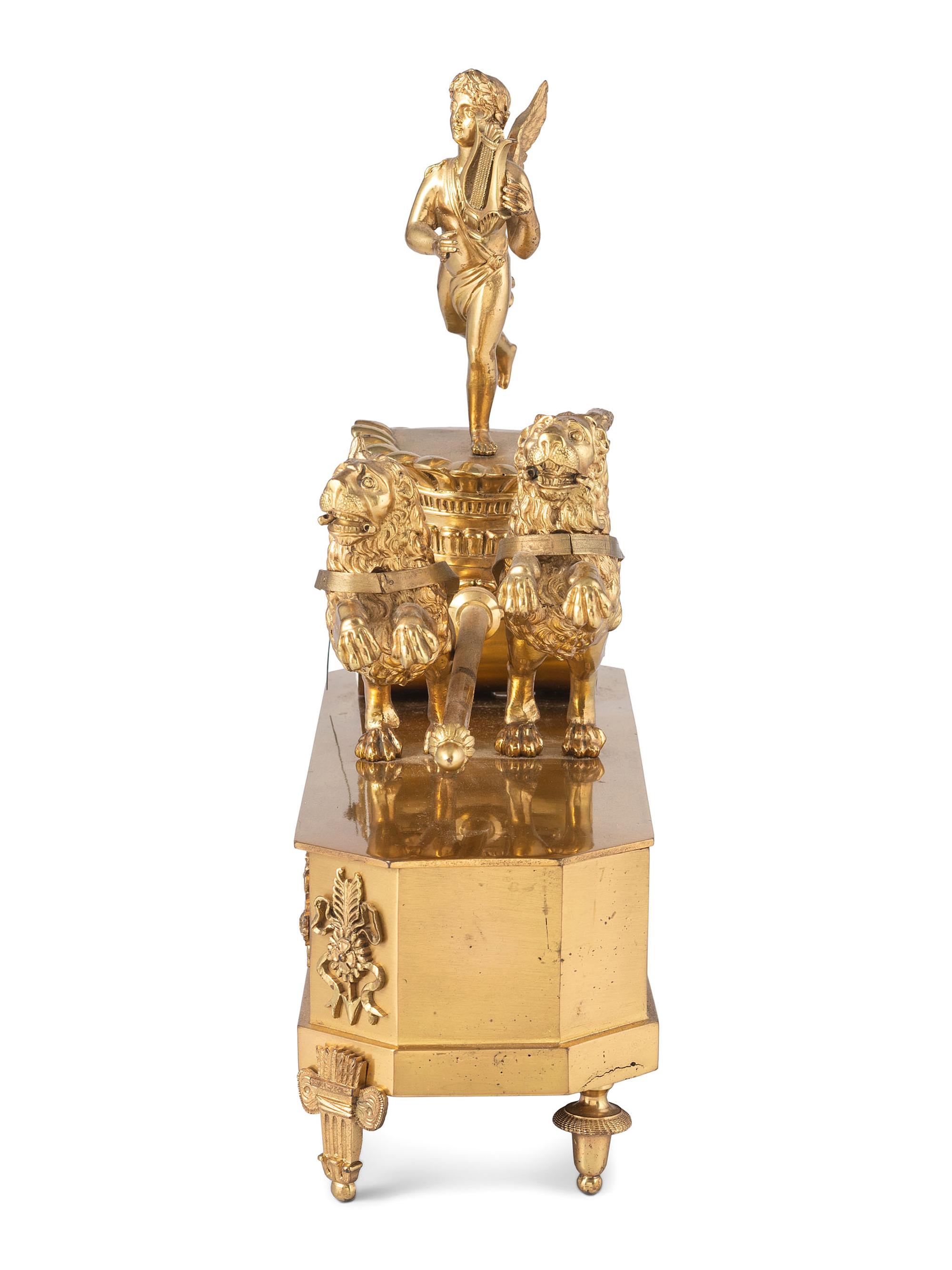 A French Ormolu Mantle Clock in the Form of a Chariot with Apollo and Lions