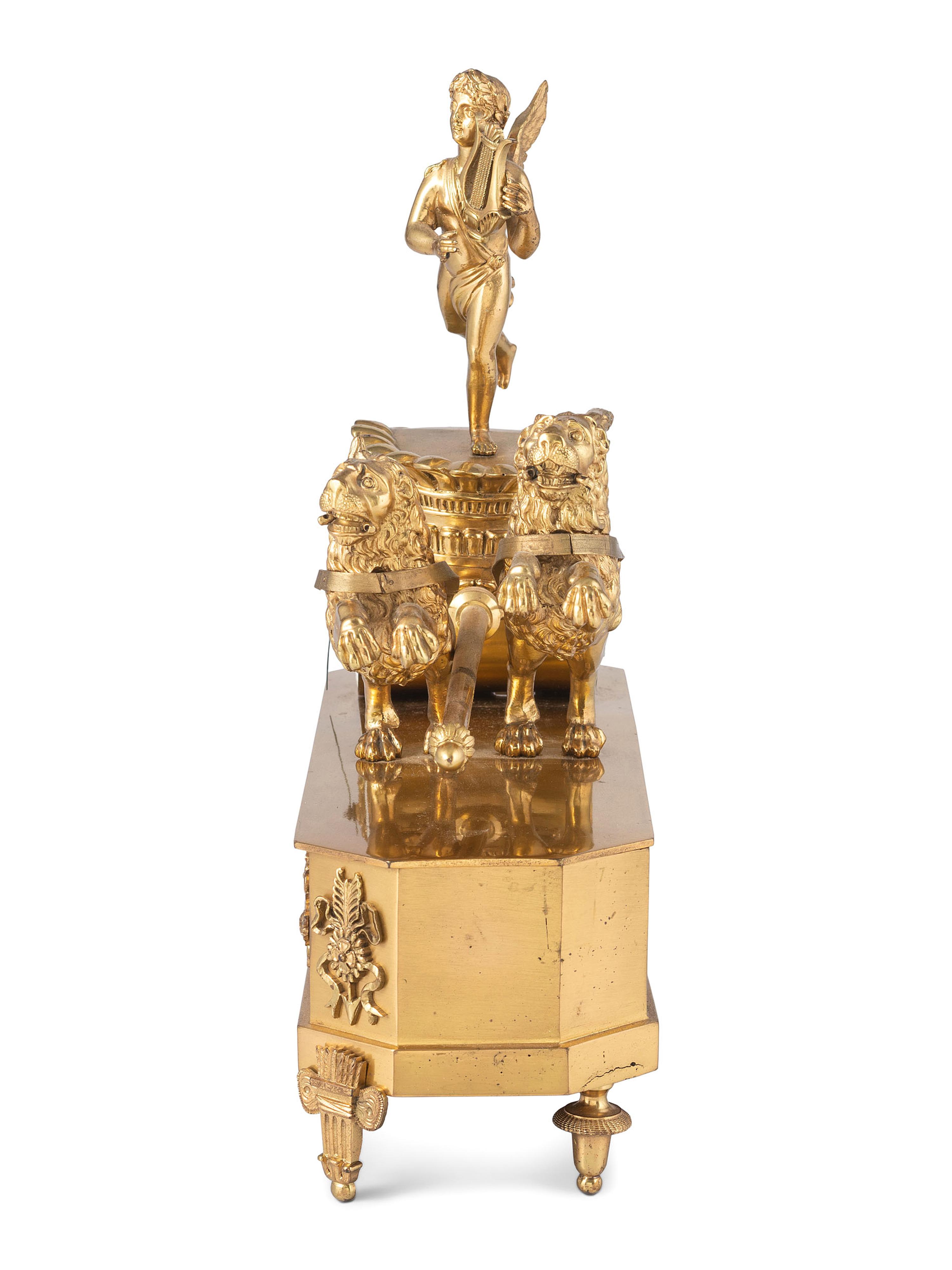 A French Ormolu Mantle Clock in the Form of a Chariot with Apollo and Lions