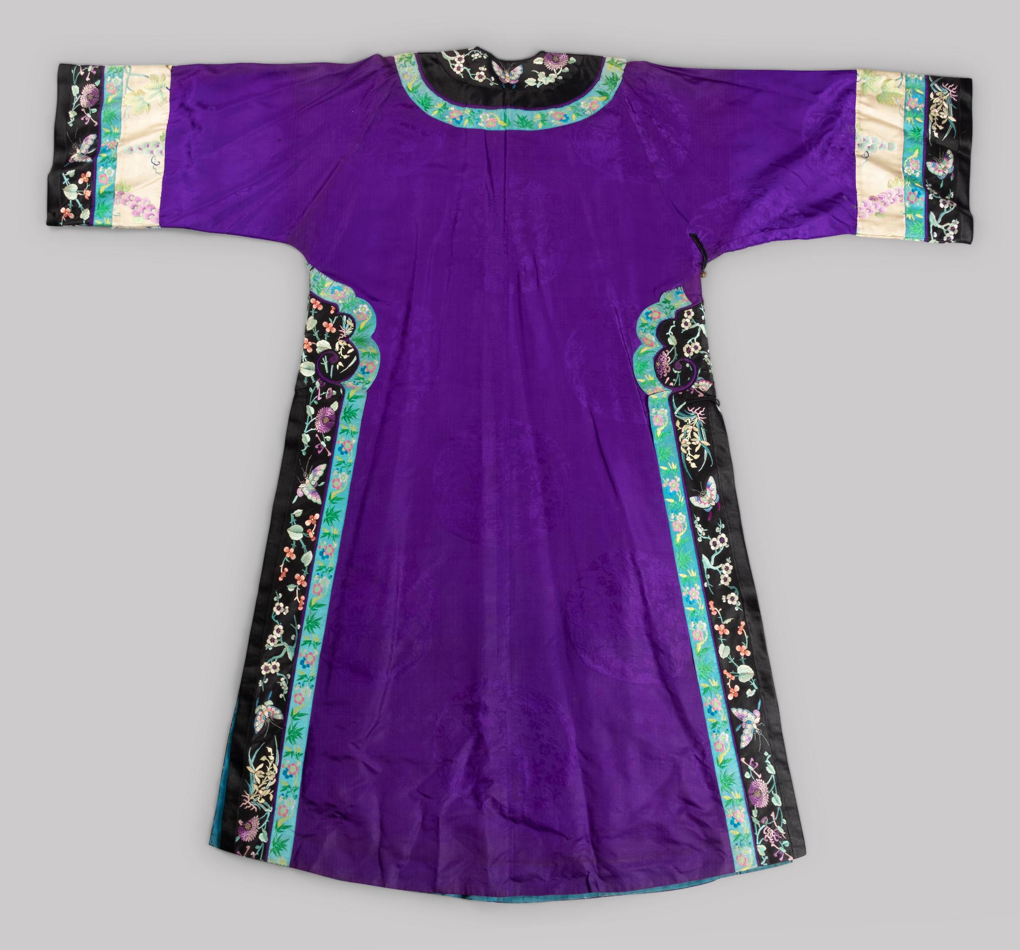 A Chinese Embroidered Silk Manchu Ladies' Robe