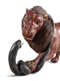 A Pair of Carved and Painted Wood Lions Wrestling Serpents