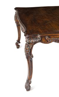 A George II Style Carved Walnut Dining Table
