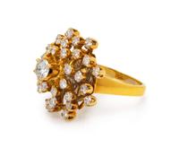 A 14 Karat Yellow Gold and Diamond Cluster Ring,