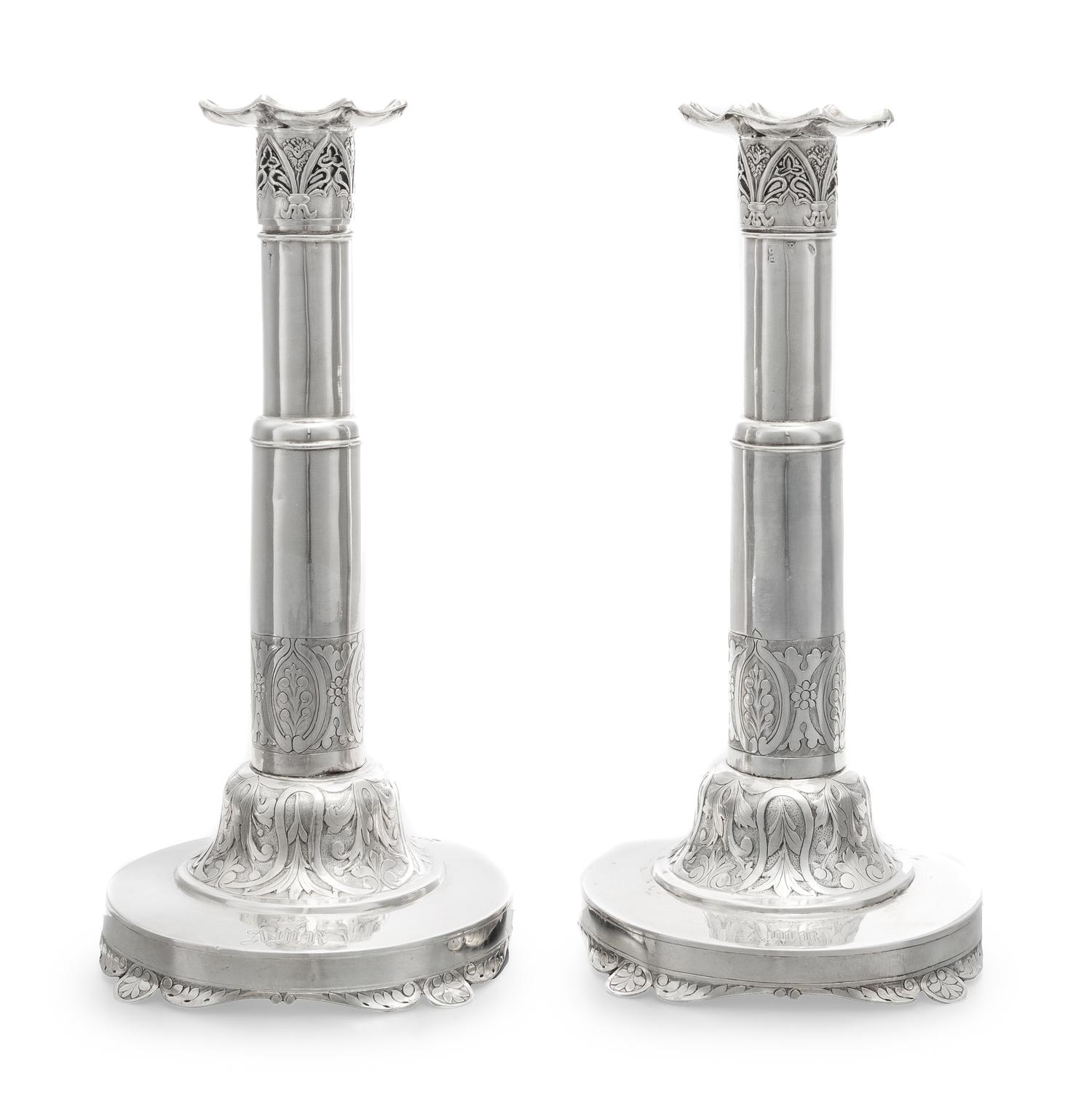 A Pair of Russian Silver Candlesticks, Maker's Mark Obscured, 1835, each set on a circular base bearing a monogram and coronet over fol