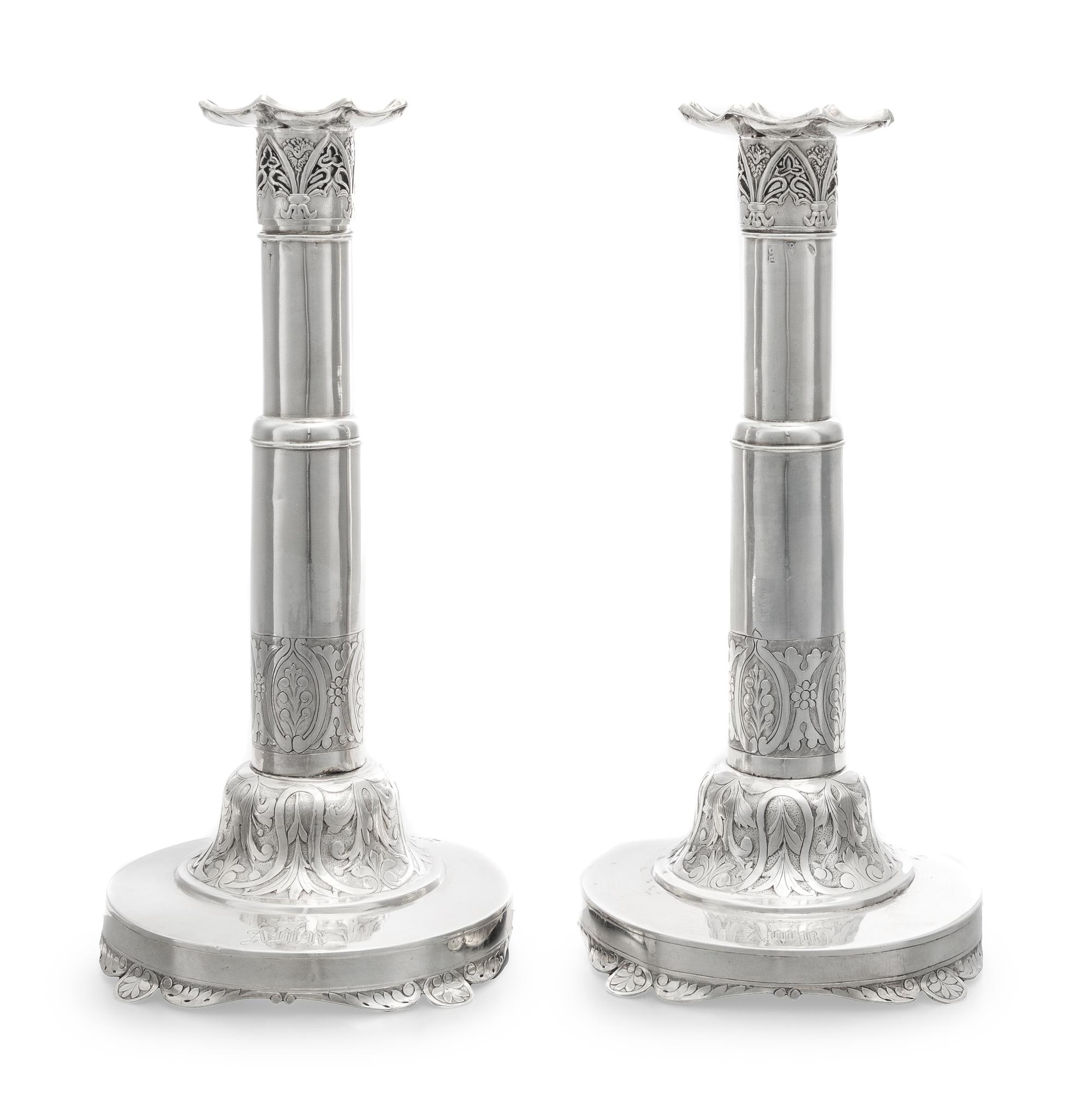 A Pair of Russian Silver Candlesticks, Maker's Mark Obscured, 1835, each set on a circular base bearing a monogram and coronet over fol