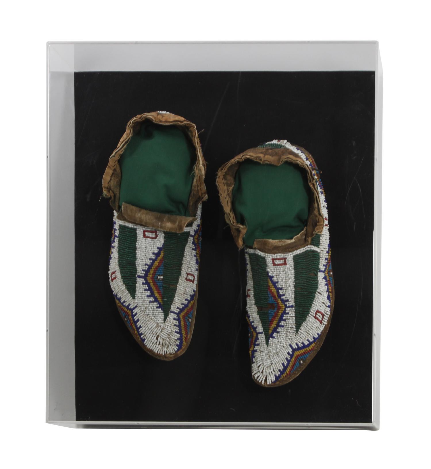 A Pair of Sioux Mocassins Length 10 1/2 inches — CIRCA 1900