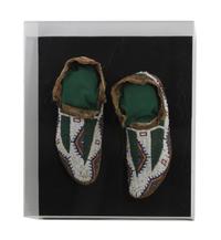 A Pair of Sioux Mocassins Length 10 1/2 inches — CIRCA 1900