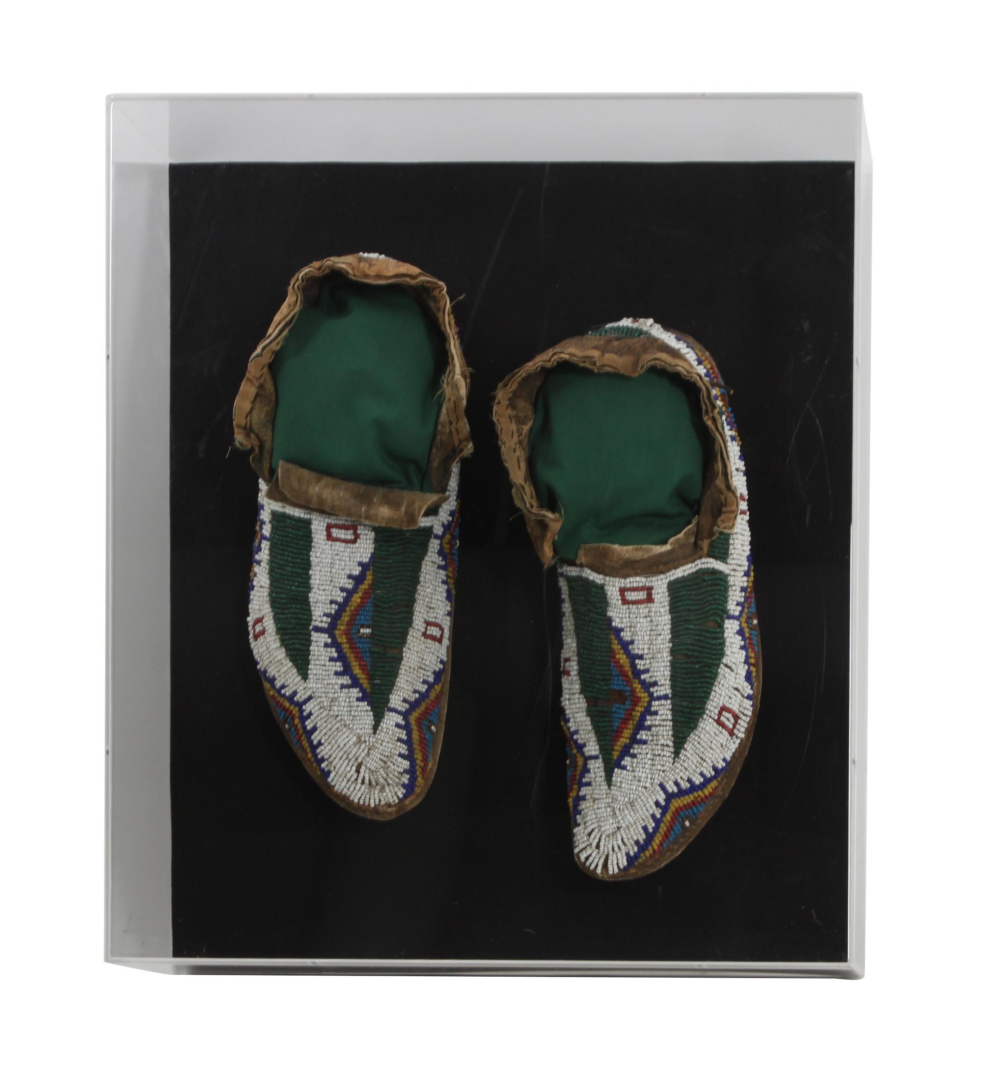 A Pair of Sioux Mocassins Length 10 1/2 inches — CIRCA 1900