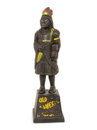 An Old Honesty Cast Iron Indian Cigar Bank, PLUS