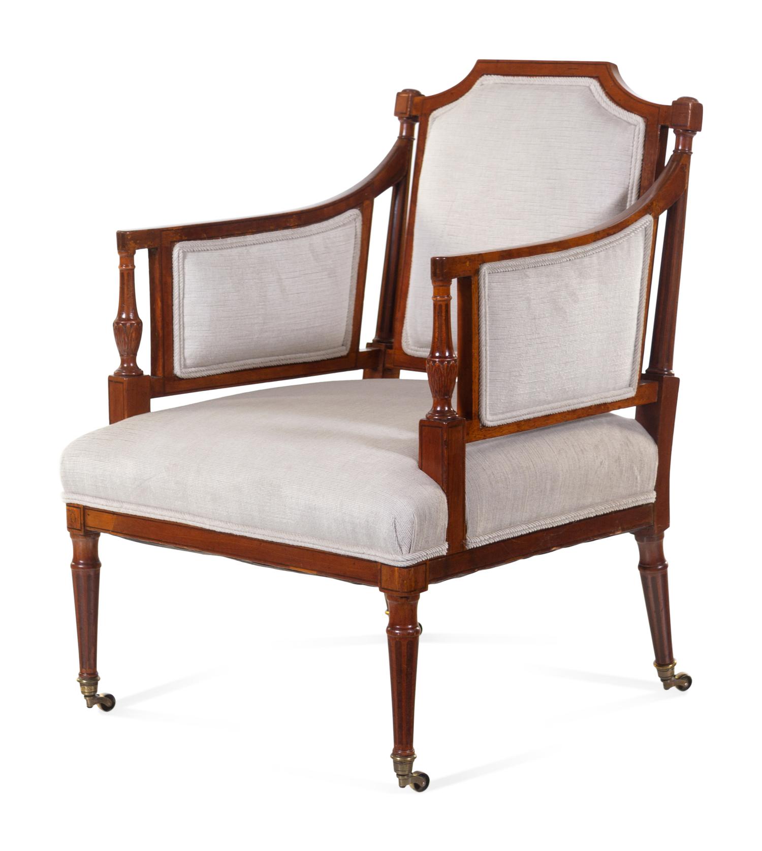 A Regency Style Carved and Inlaid Mahogany Armchair