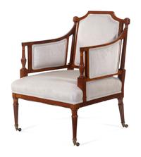 A Regency Style Carved and Inlaid Mahogany Armchair