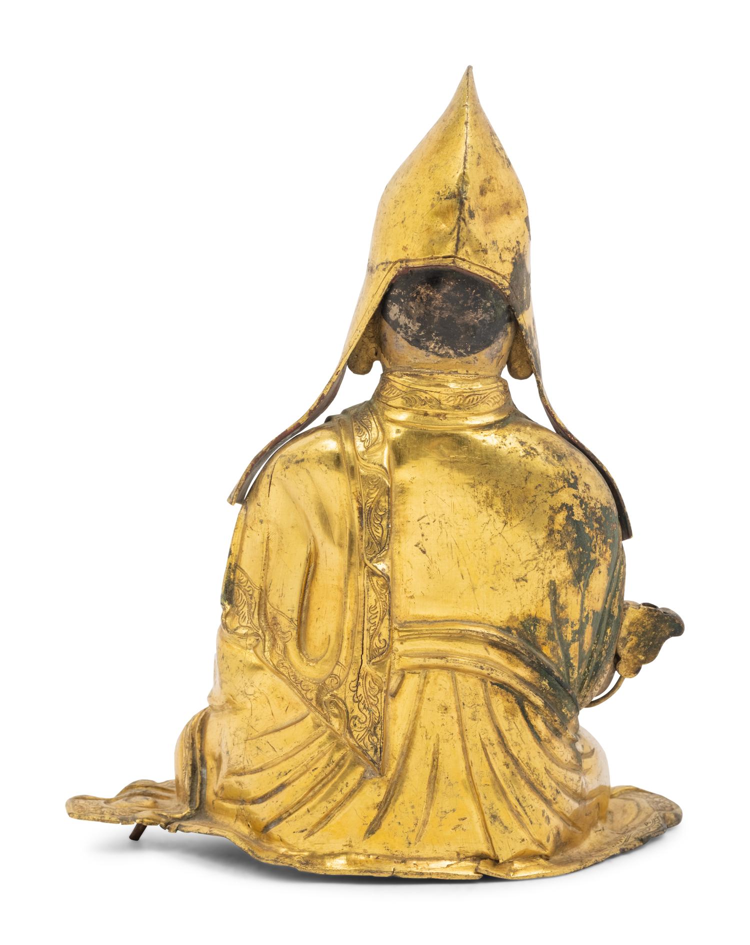 A Tibetan Gilt Bronze Repoussé Seated Figure of Tsongkhapa
