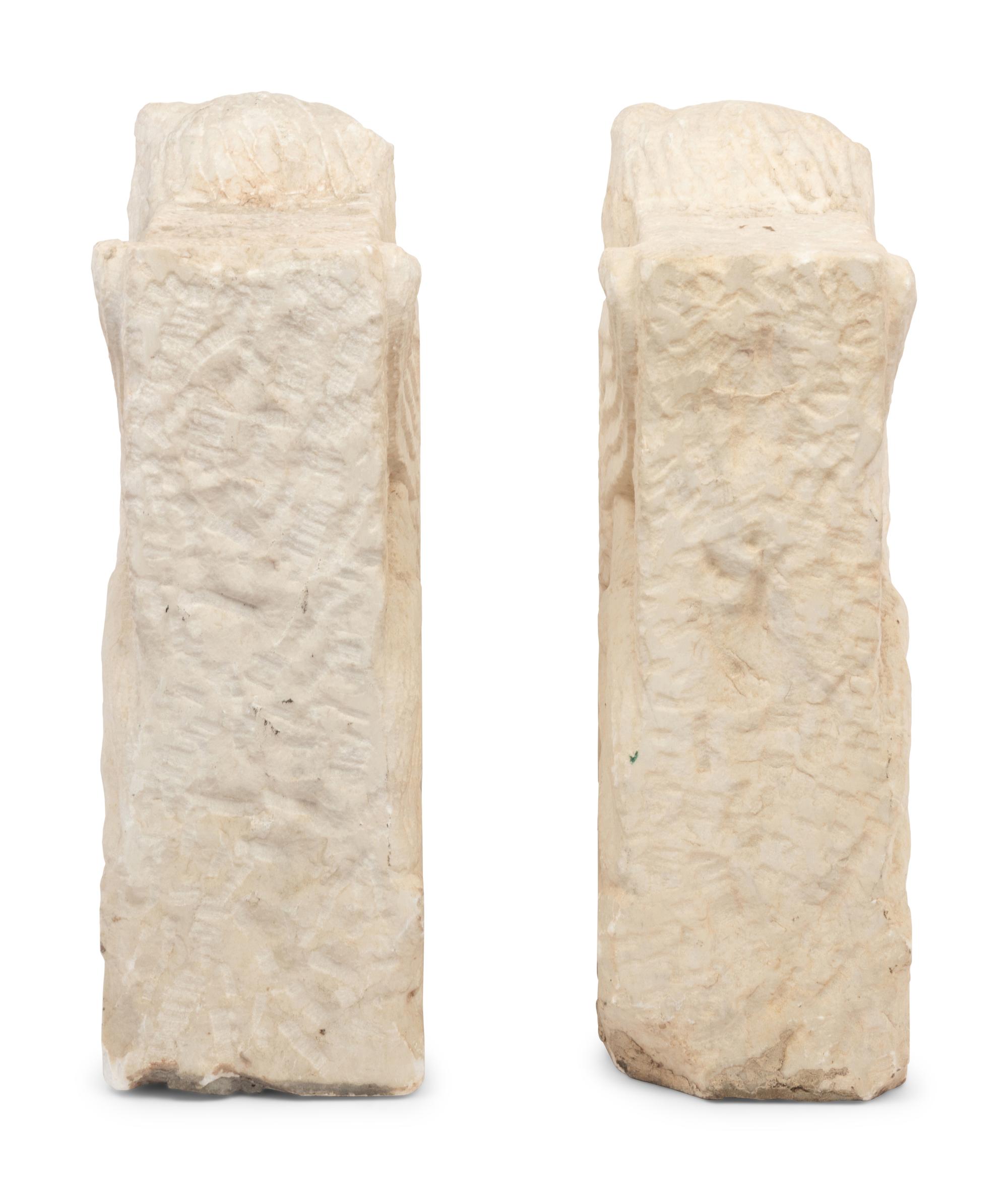 A Pair of Gothic Style Carved Marble Ornaments