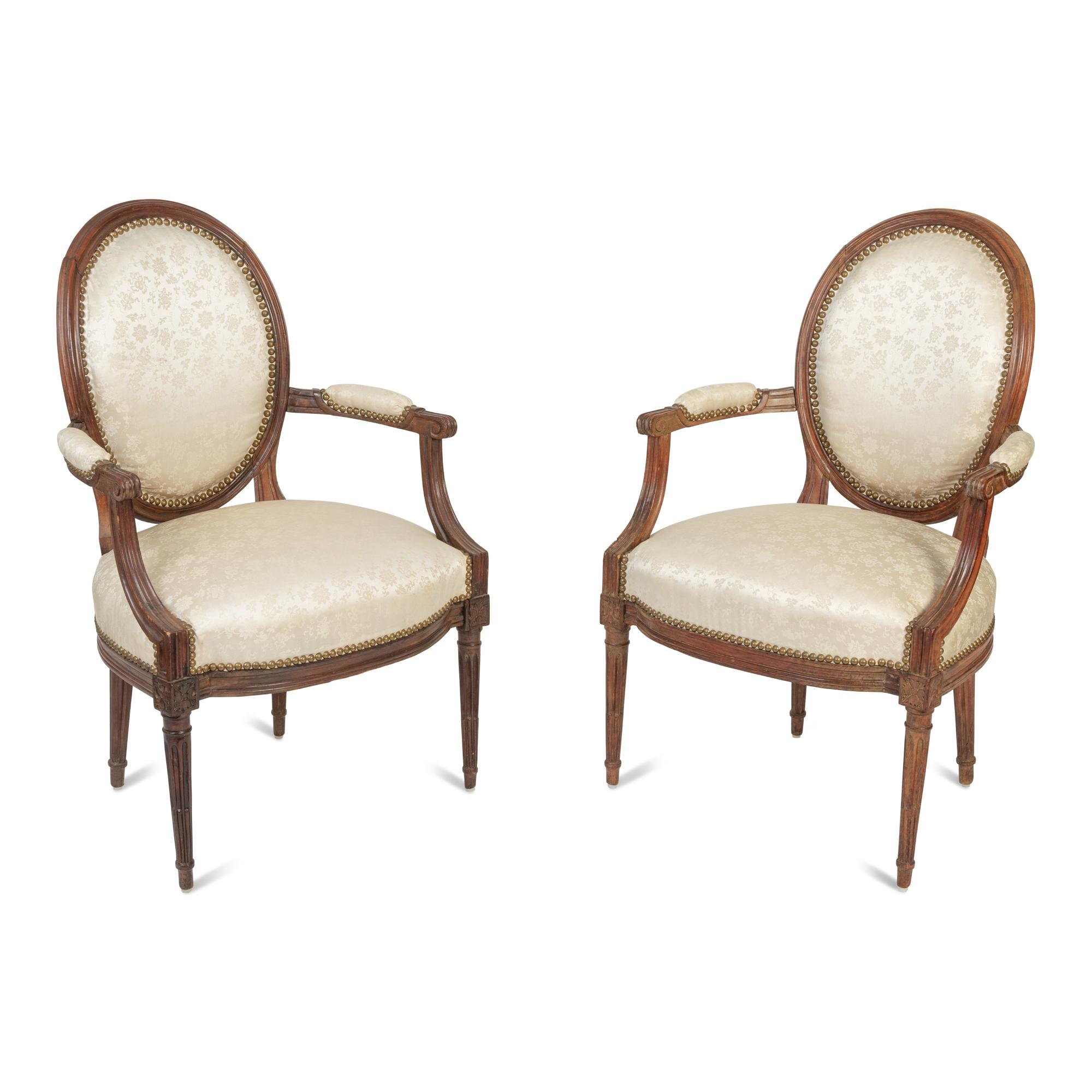 A Pair of Louis XVI Walnut Fauteuils en Cabriolet