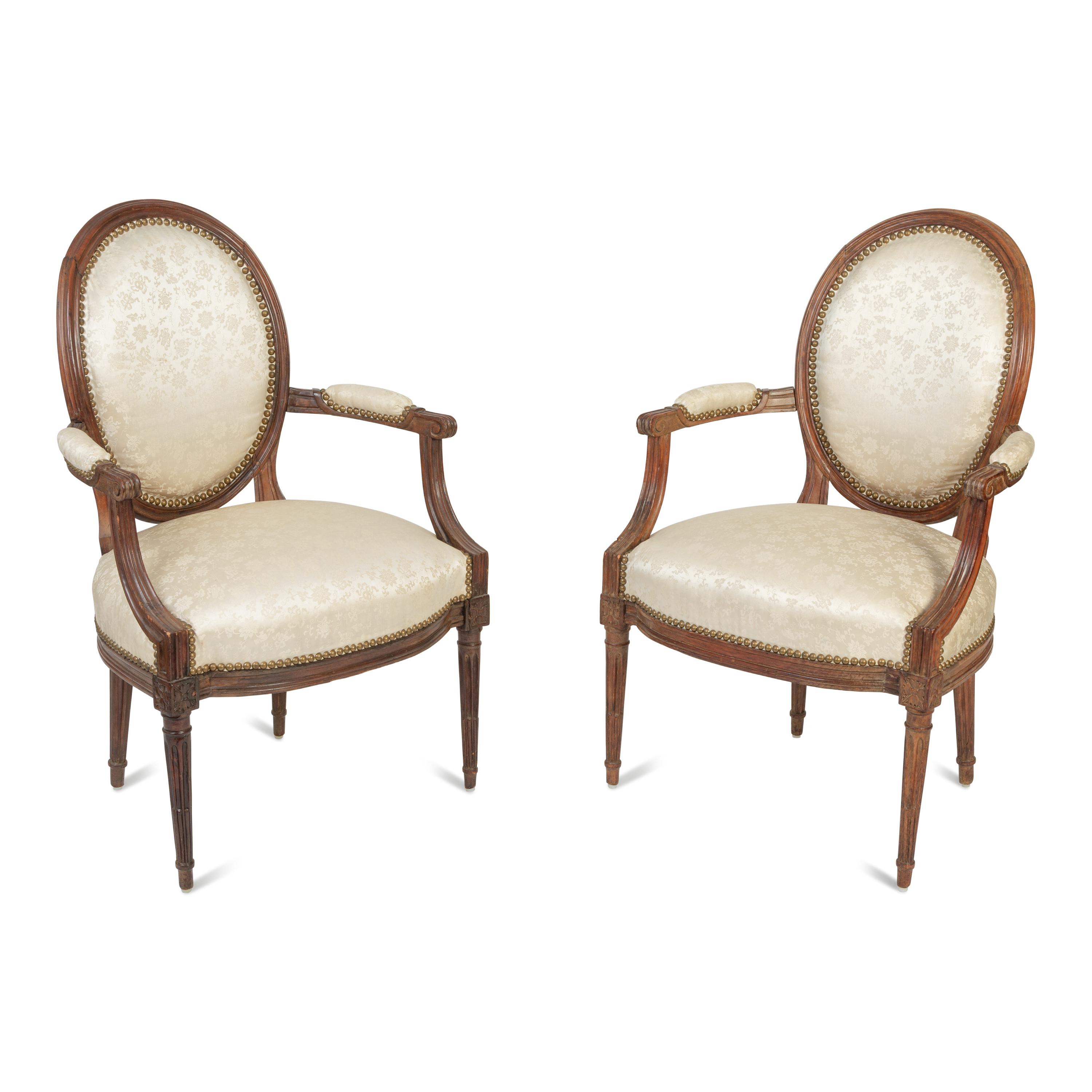 A Pair of Louis XVI Walnut Fauteuils en Cabriolet