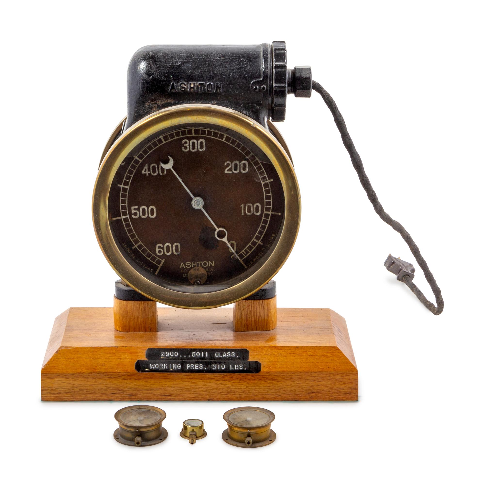 An Ashton Mfg Co., Brass Cased Pressure Gauge
