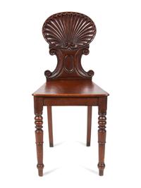 A Pair of Regency Style Mahogany Hall Chairs