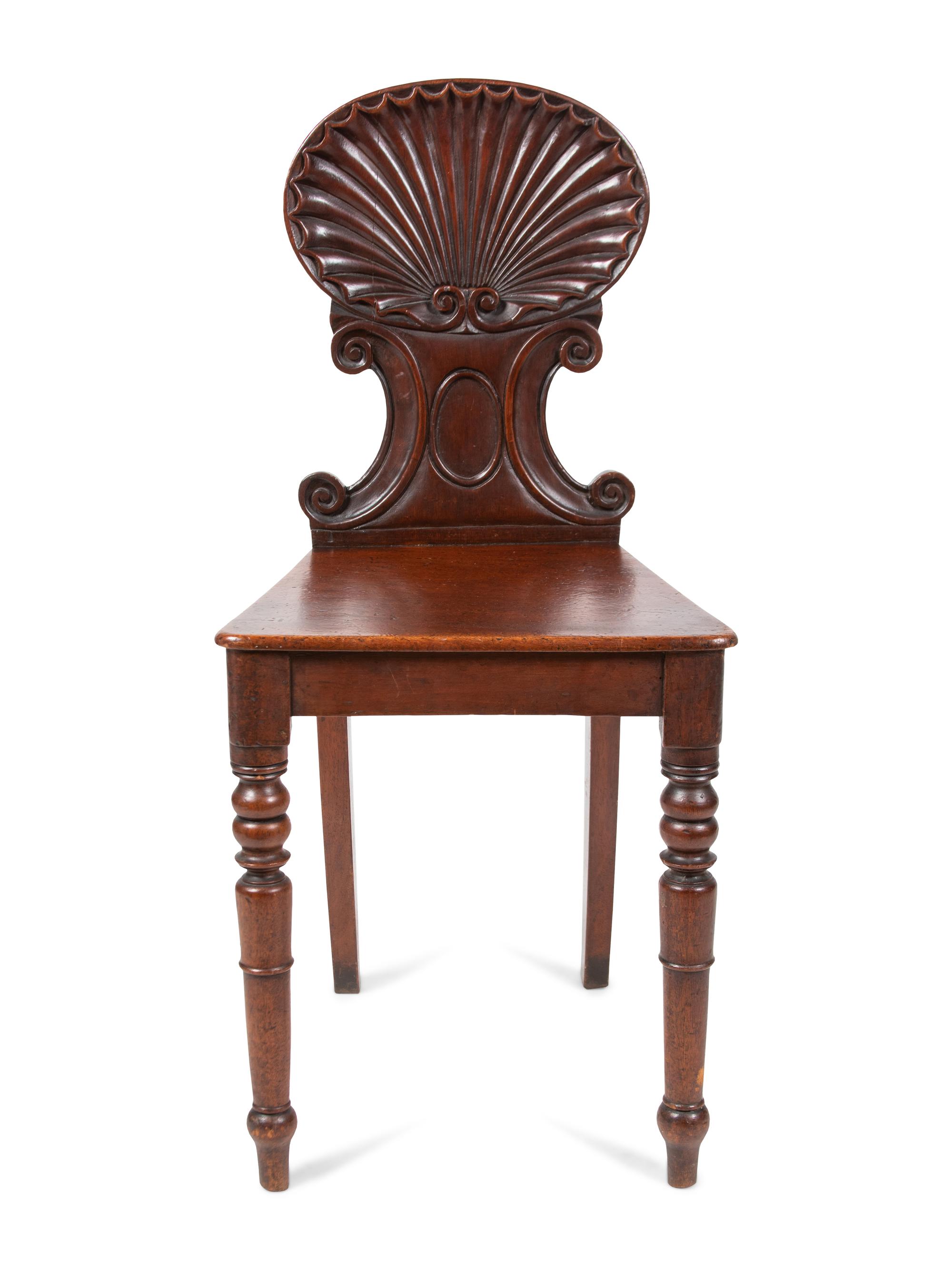 A Pair of Regency Style Mahogany Hall Chairs