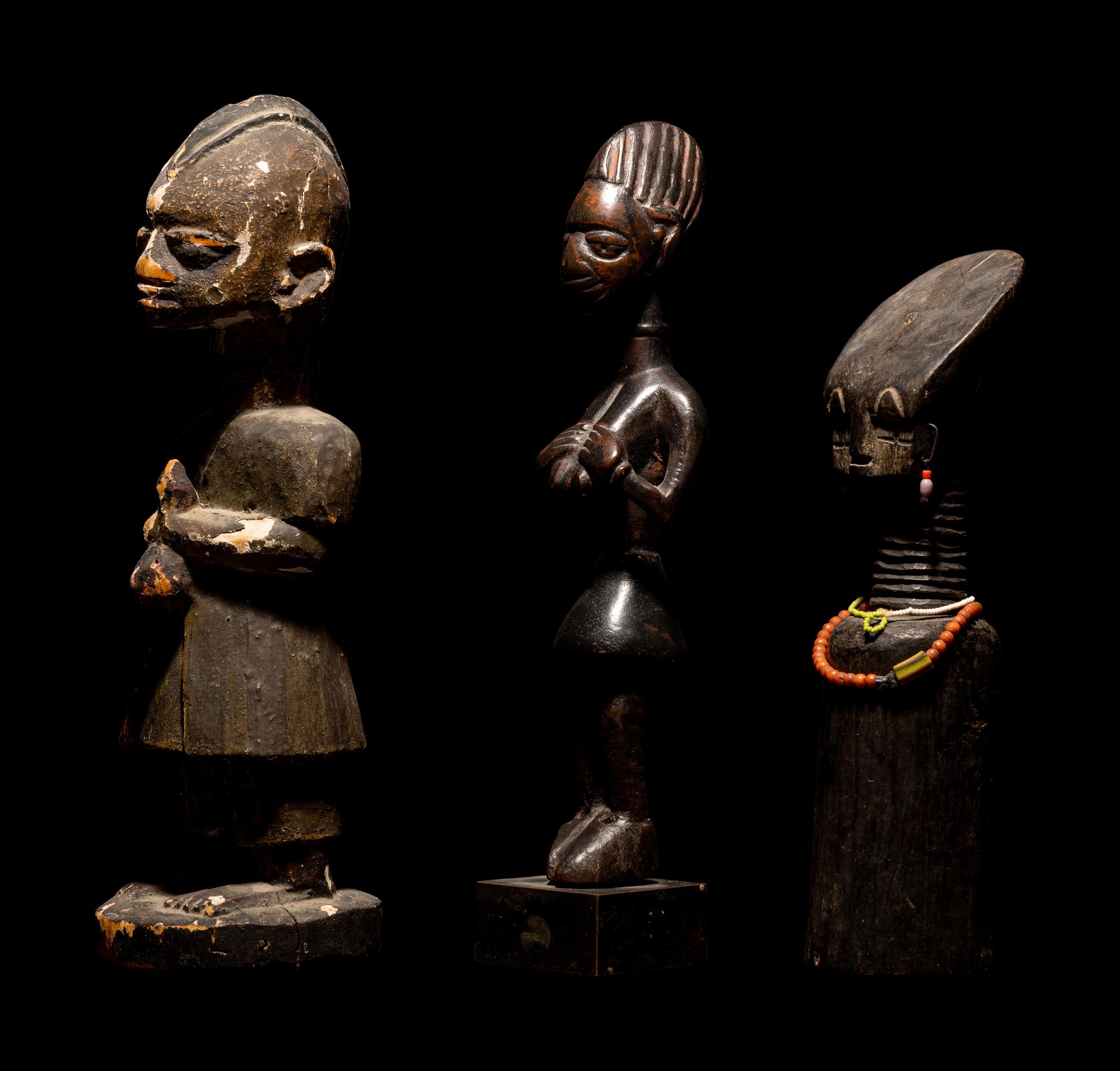 Three Dan Passport Masks, An Ashanti Wood Idol, and Two Wood Figures