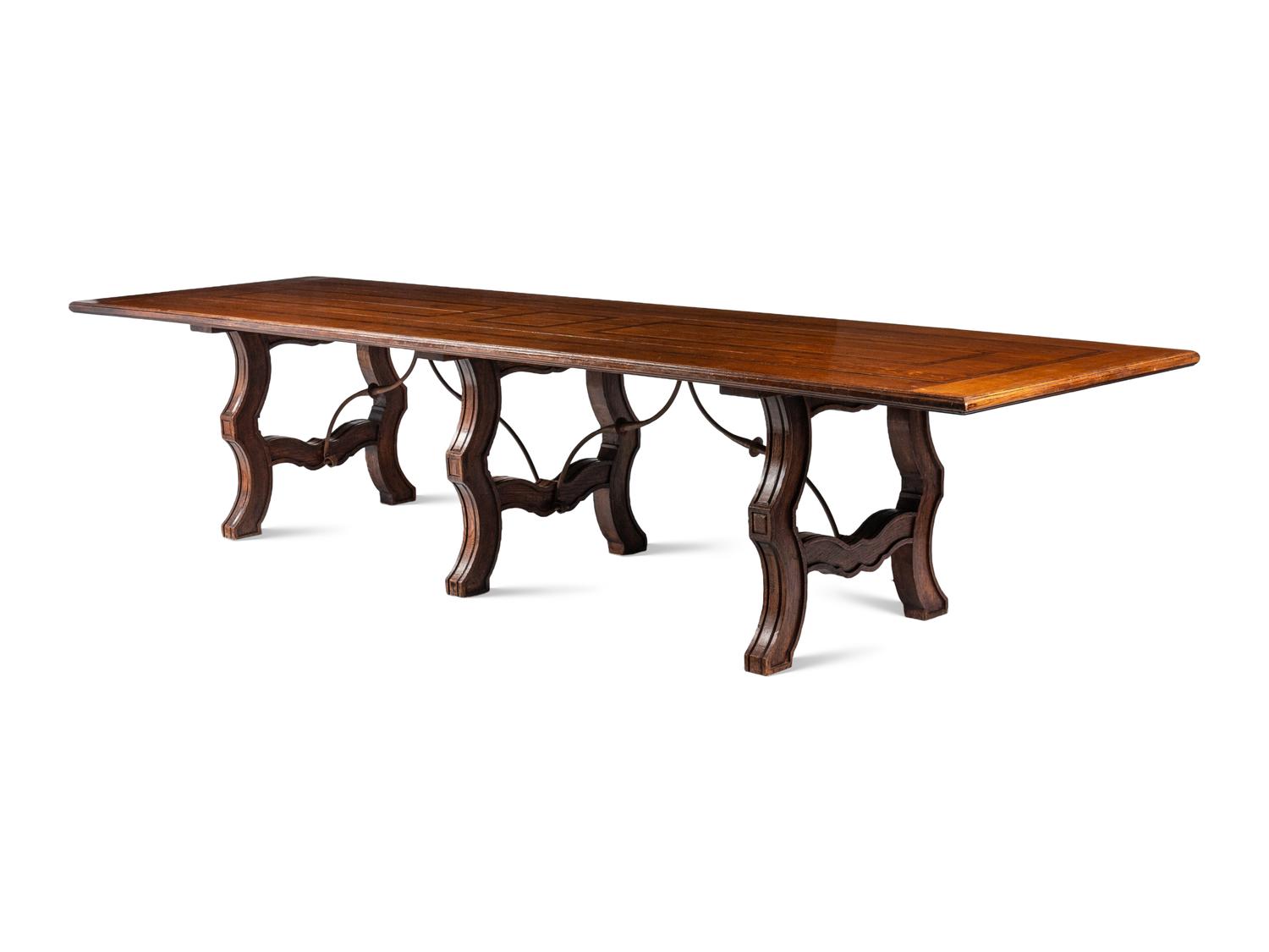 A Large Italian Renaissance Style Iron Mounted Oak and Burl Walnut Library Table