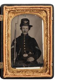 [CIVIL WAR]. Tintype of a triply armed corporal with musket, pistol, and knife.