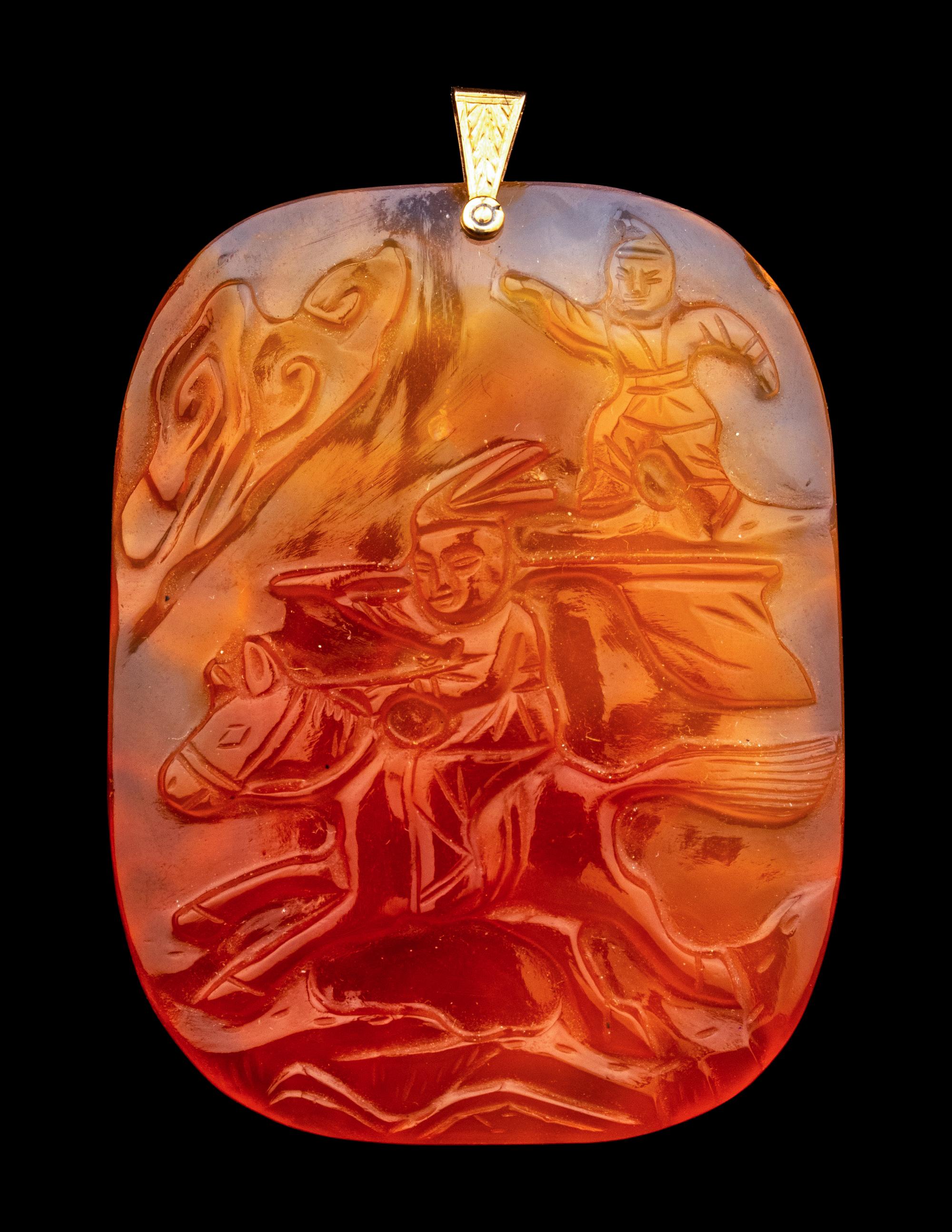 A Group of Chinese Red Carnelian and Coral Pendants