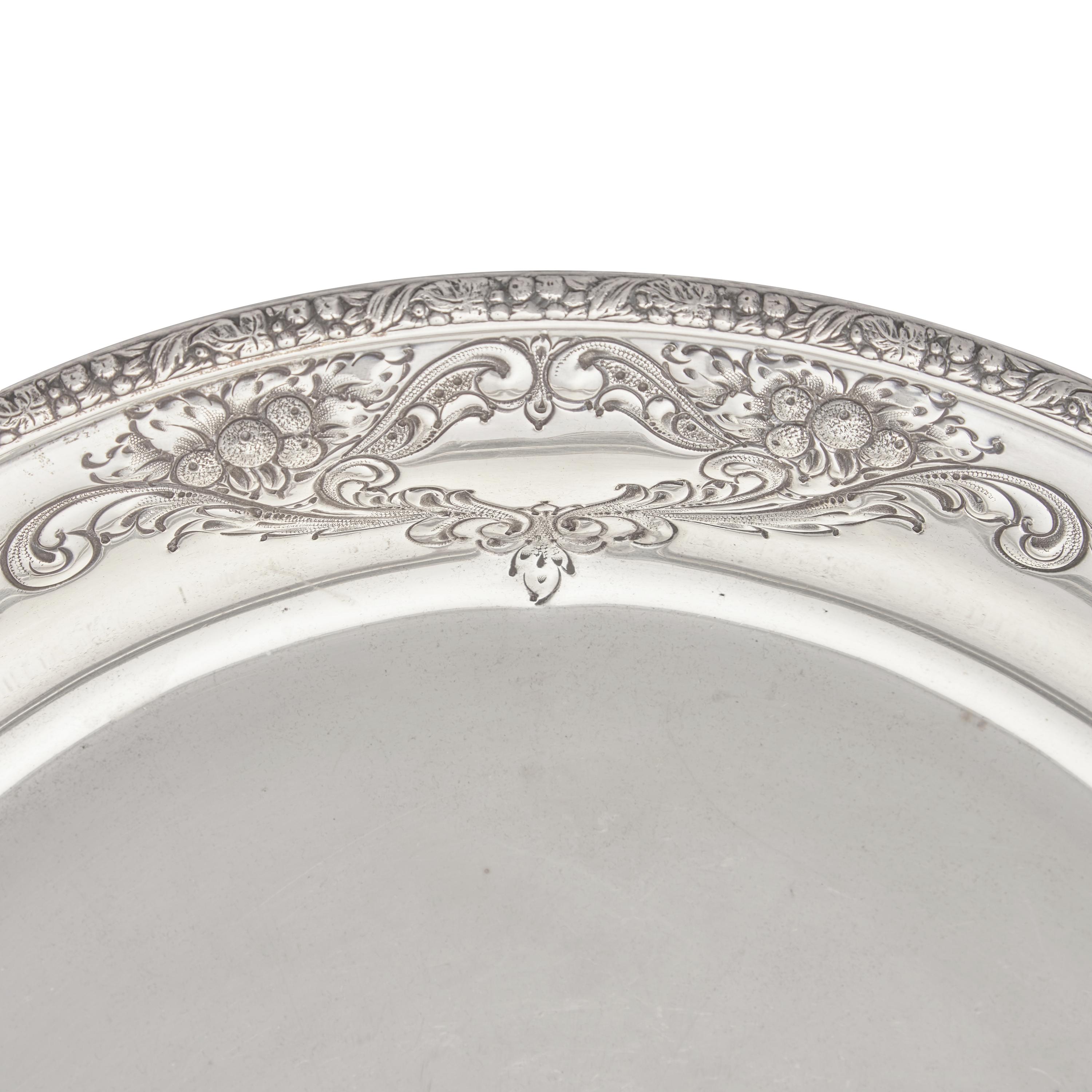 A Sterling Silver Floral Repousse Dished Tray in the Champlain Pattern