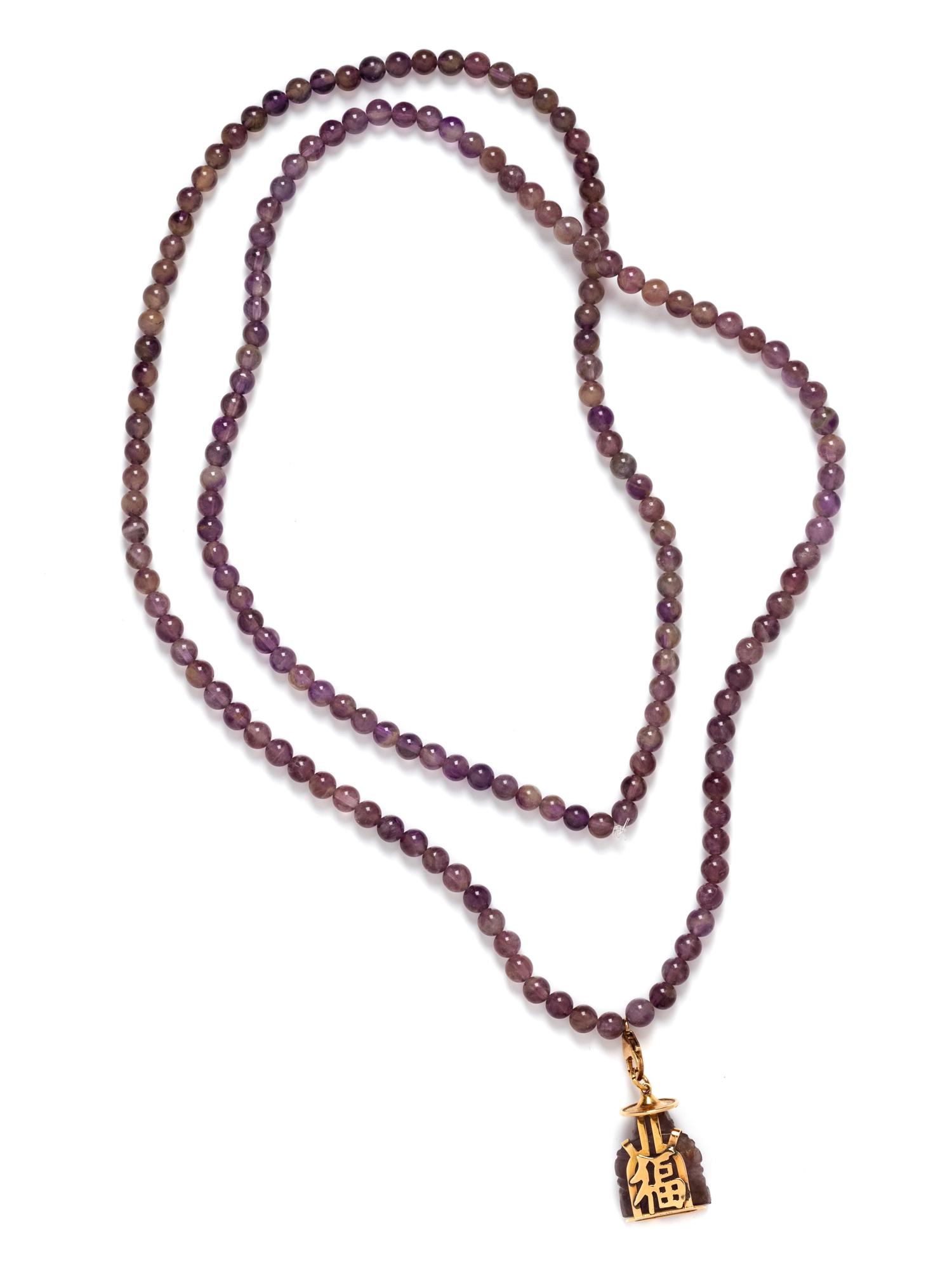 An 18 Karat Yellow Gold, Amethyst and Ruby Buddha Pendant/Necklace,
