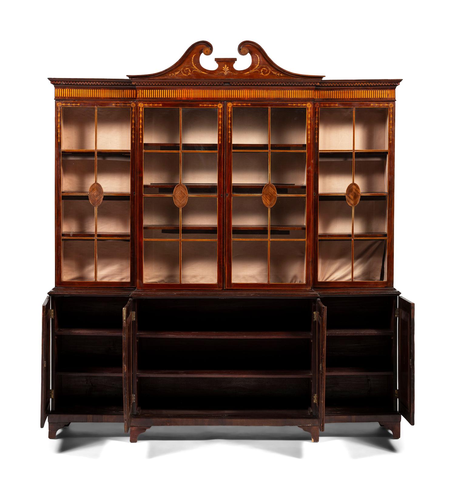 An English Mahogany and Marquetry Breakfront Bookcase