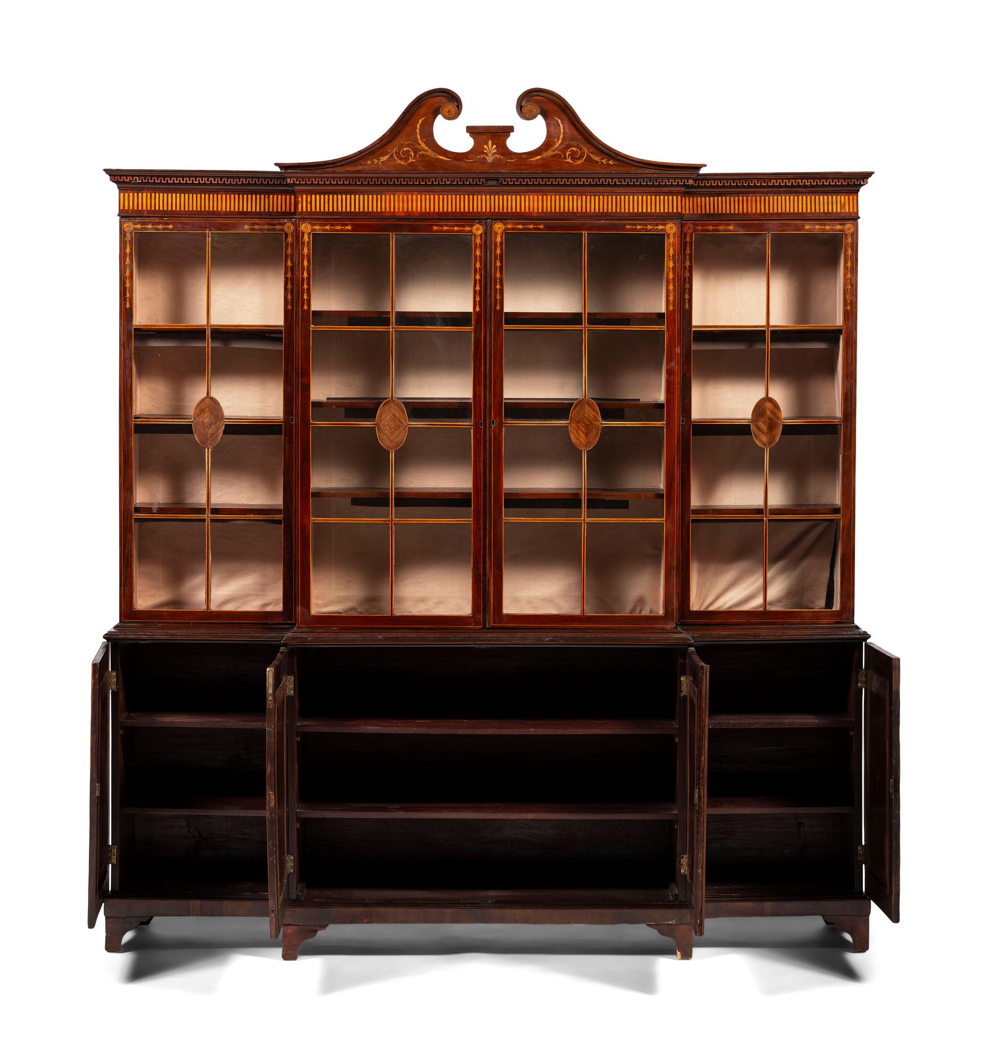 An English Mahogany and Marquetry Breakfront Bookcase