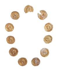 Eleven Gilt Metal or Gold Buttons on an Acrylic Stand