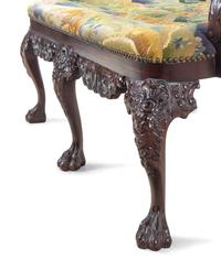 A Pair of Irish George II Style Carved Mahogany Double-Back Settees