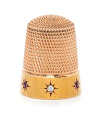 An American 14-Karat Yellow Gold, Diamond and Ruby Thimble, Simons Brothers Co., Philadelphia, PA, the knurled top and body above a pla