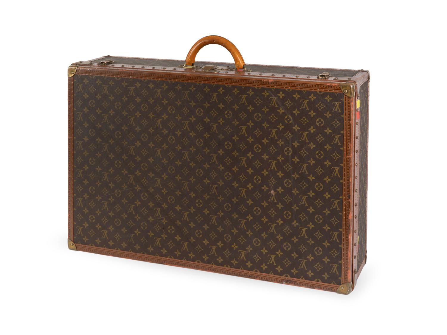 A Louis Vuitton Monogram Canvas Hardside Suitcase — 20TH CENTURY