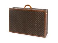 A Louis Vuitton Monogram Canvas Hardside Suitcase — 20TH CENTURY