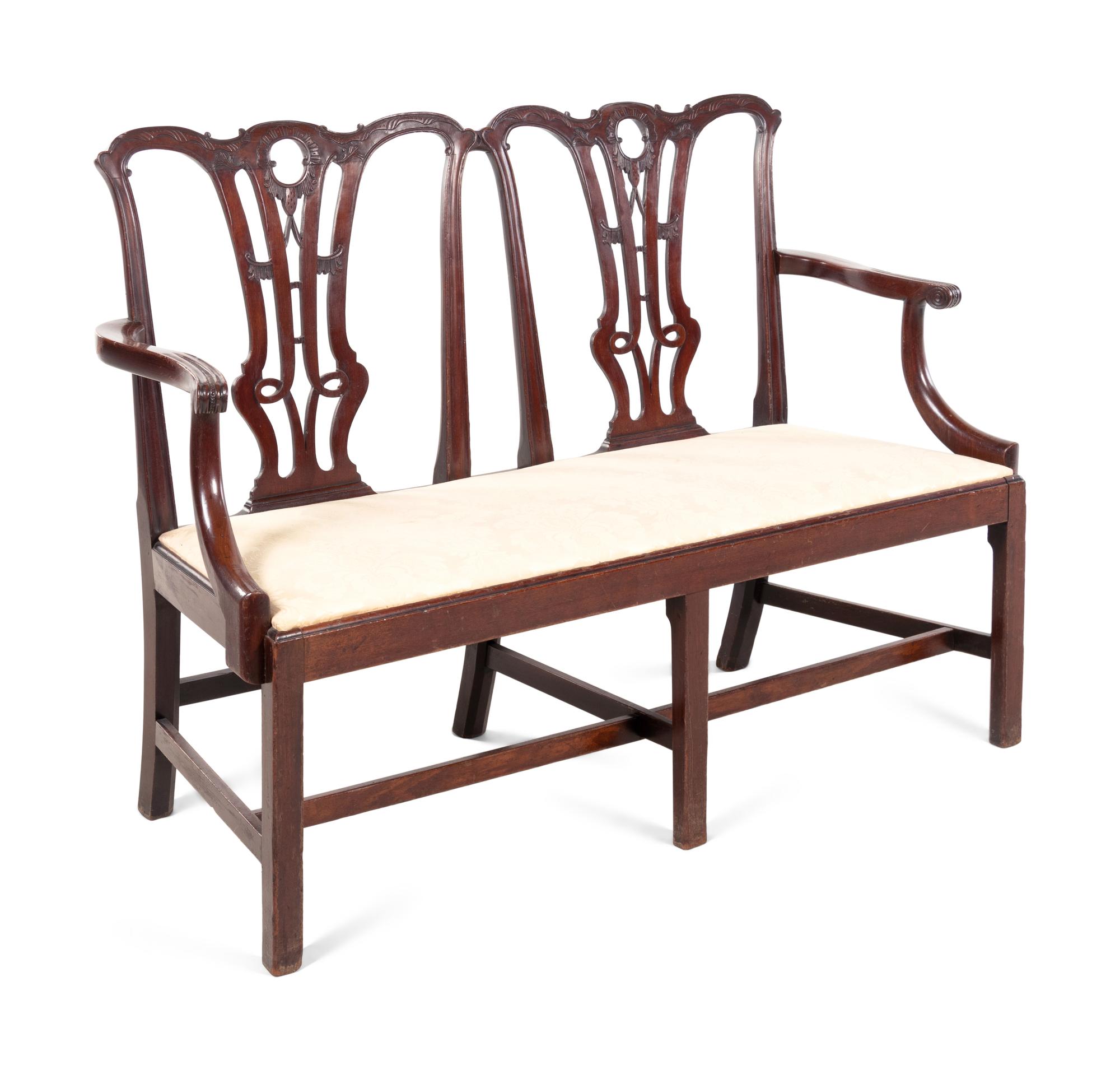 A George III Style Carved Mahogany Double-Back Settee
