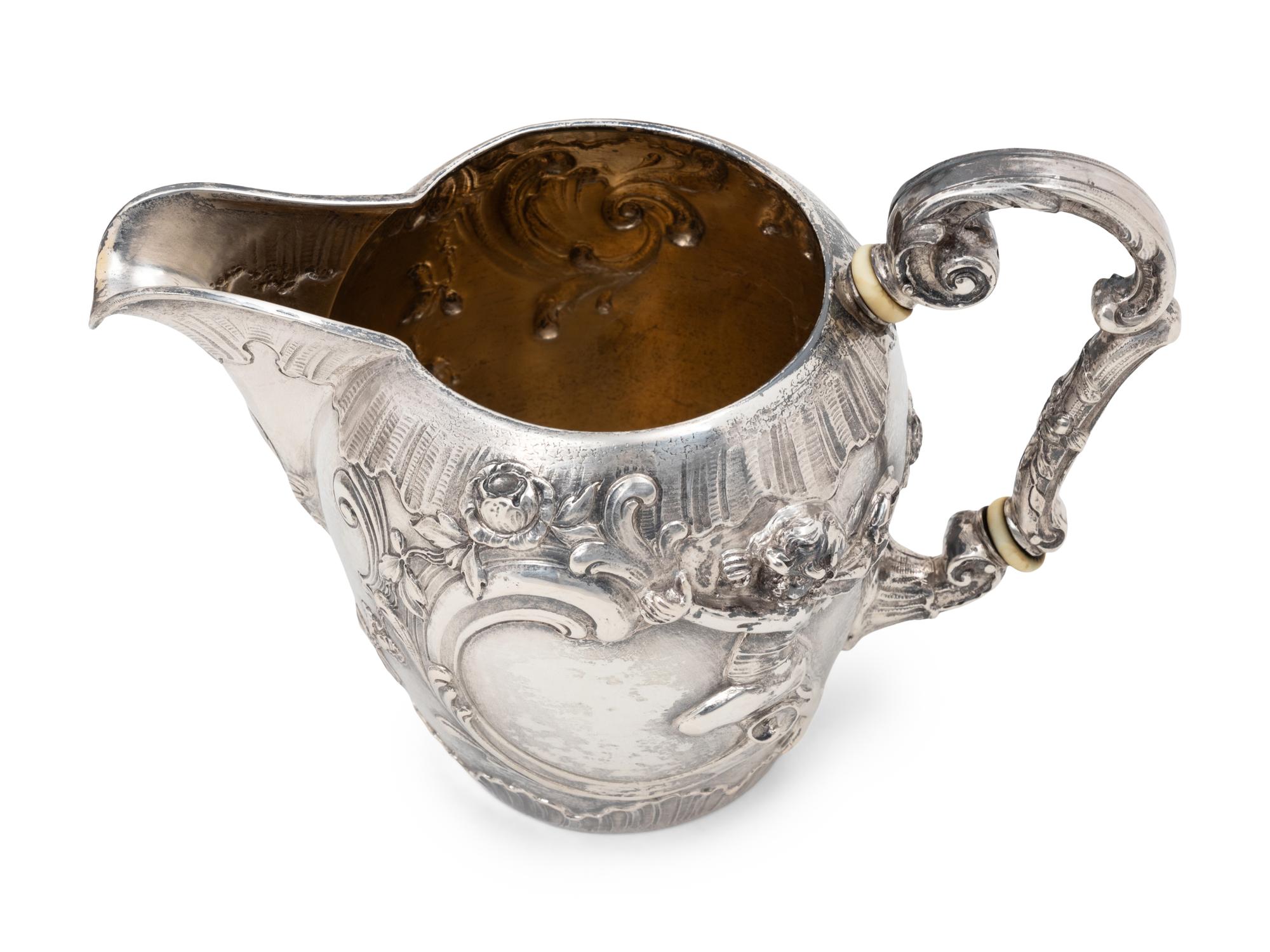 A Rare German Silver Two-Tier Tea Table with Matching Five-Piece Tea Service and Two Trays