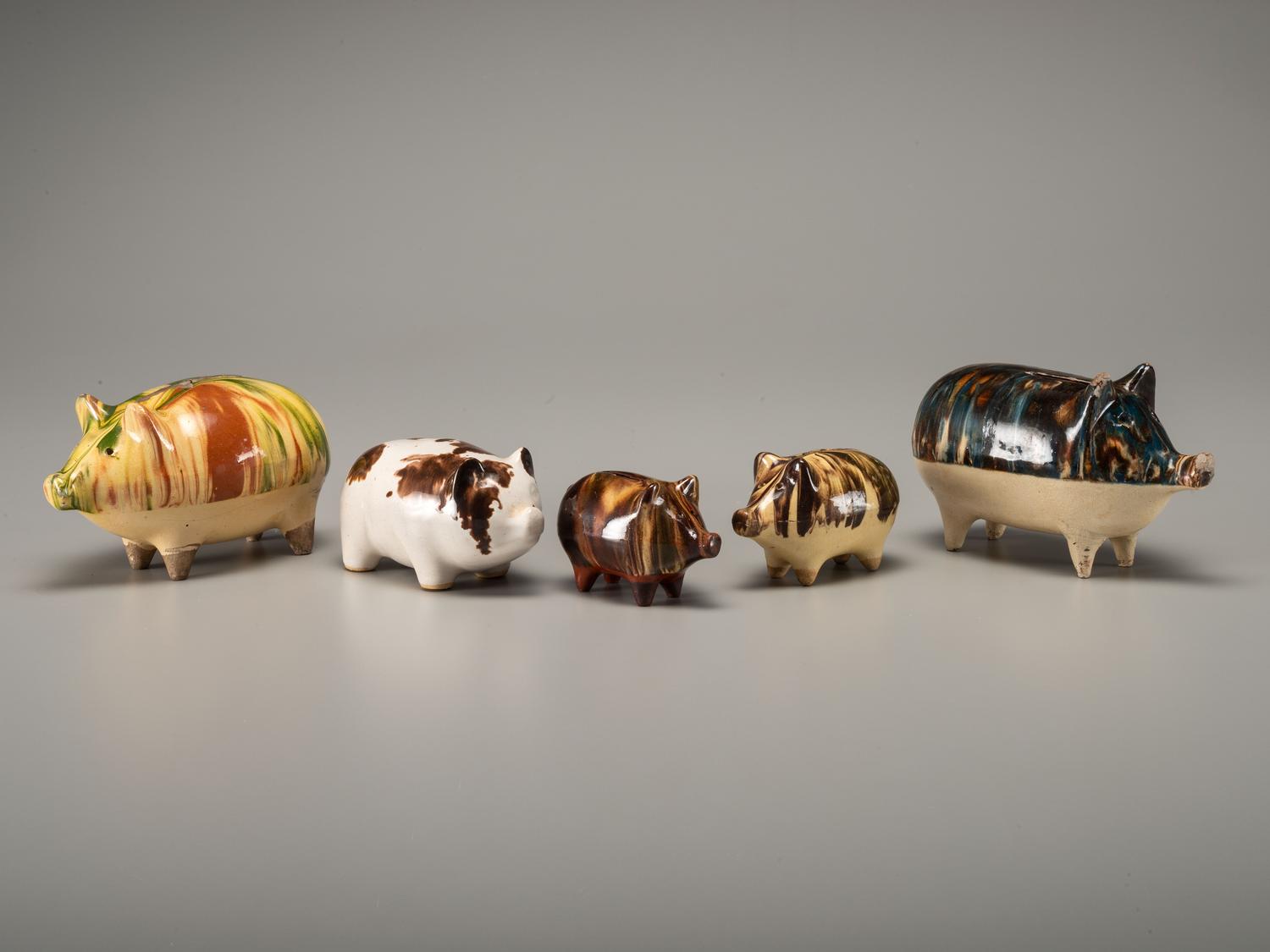 Fifteen Rockingham Glaze Mugs and Pig Banks