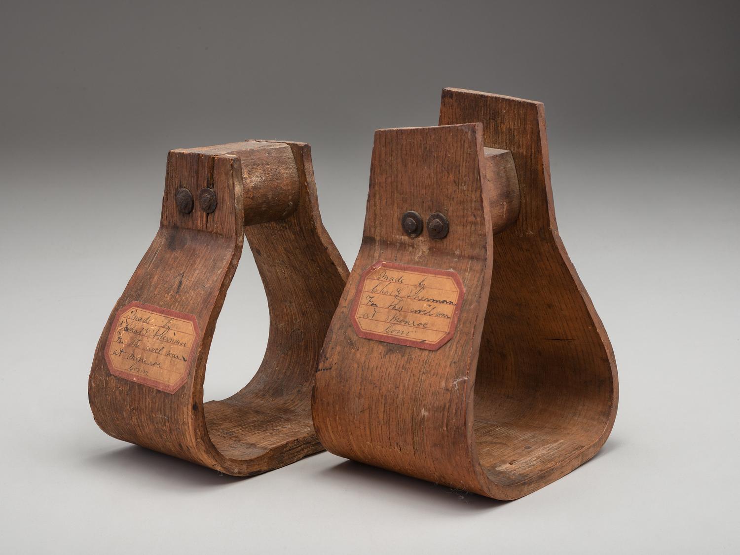 [CIVIL WAR]. Two Civil War stirrups. Made by Charles G. Sherman, Monroe, CT.